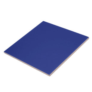 an aeroplane flying in the sky with a blue backgro tile
