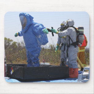 An airman stands in a tub mouse mat