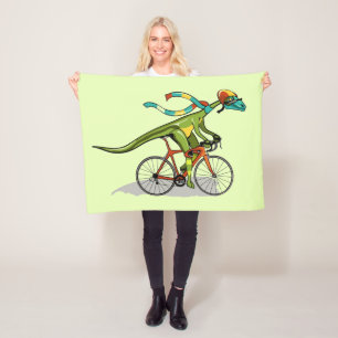 An Anabisetia Dinosaur Riding A Bicycle. Fleece Blanket