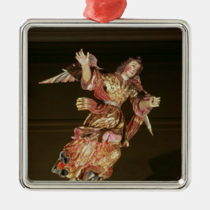 An angel above the altarpiece metal tree decoration