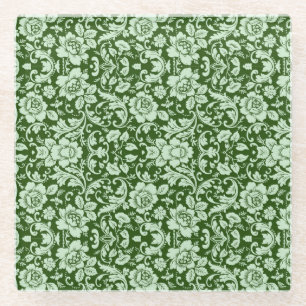 An antique floral damask glass coaster