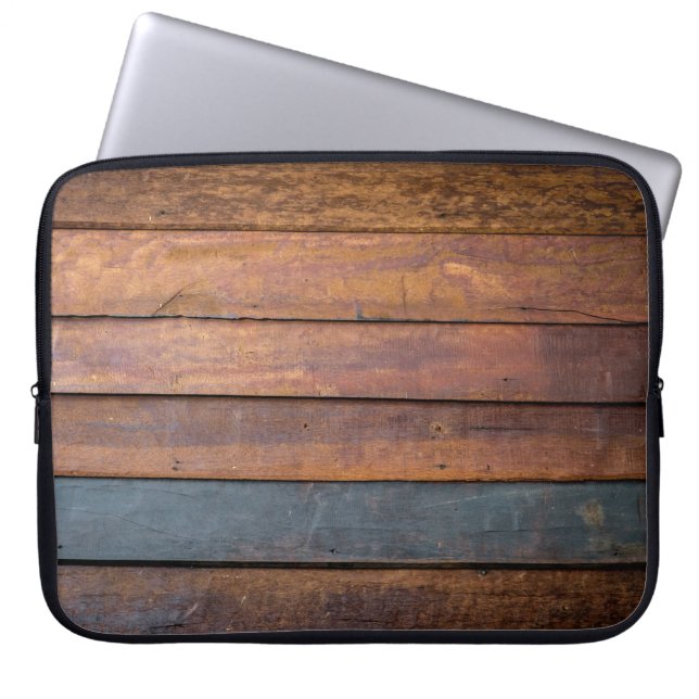 An antique wood wall texture background with metal laptop sleeve (Front)
