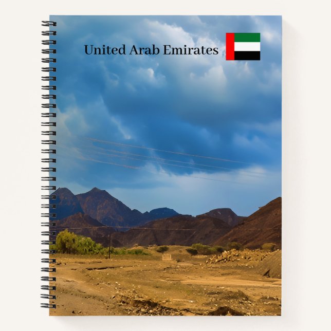 An arid landscape under a dramatic, cloudy sky notebook (Front)