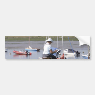 An artist at Bosham Harbour, West Sussex, England. Bumper Sticker