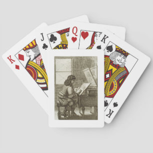 An artist copying onto an engraving plate, printed playing cards