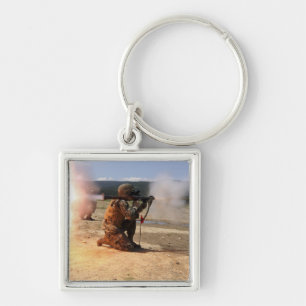 An assaultman fires a Rocket Propelled Grenade Key Ring