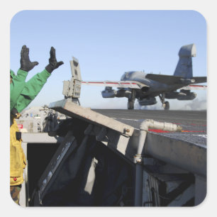 An EA-6B Prowler launches from the flight deck Square Sticker