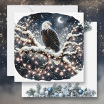 An Eagle atop a Snow filled Branch Christmas Holiday Card<br><div class="desc">Personalised Christmas card. An eagle sitting on a snowy branch  in a tree full of pretty twinkling white Christmas lights.</div>