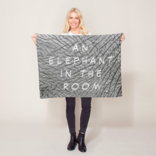 An elephant in the room skin photo with white text fleece blanket