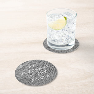 An elephant in the room skin photo with white text round paper coaster