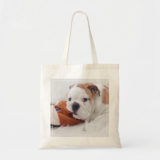 An English Bulldog Puppy Playing With A Bulldog Tote Bag (Front)