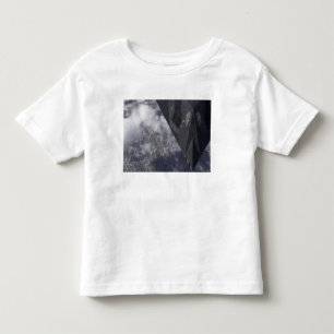 An F-117A Nighthawk flies high over the mountai Toddler T-Shirt