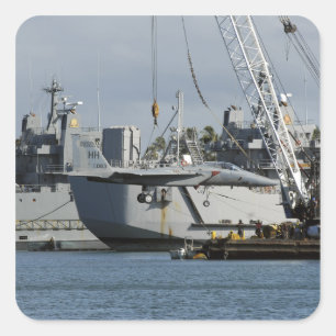 An F-15 Eagle gets a lift from a barge crane Square Sticker