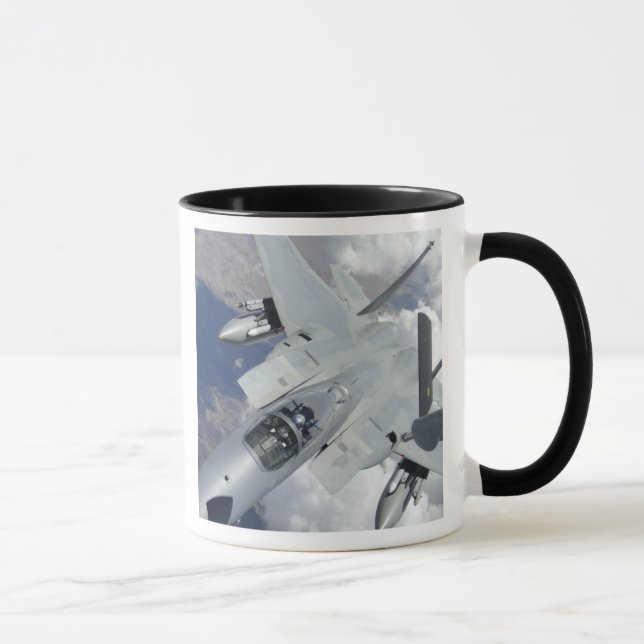 An F-15 Eagle pulls away from a KC-135 Mug (Right)