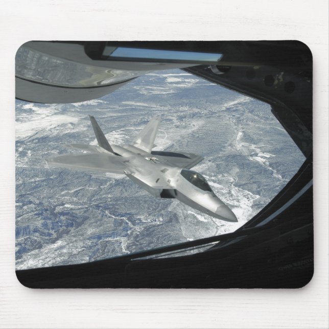 An F-22 Raptor banks away from a KC-135 Mouse Mat (Front)