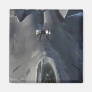 An F-22 Raptor moves into position to receive f Magnet