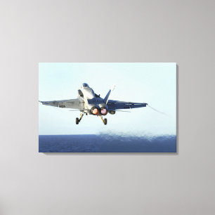 An F/A-18C Hornet launches from the flight deck 2 Canvas Print