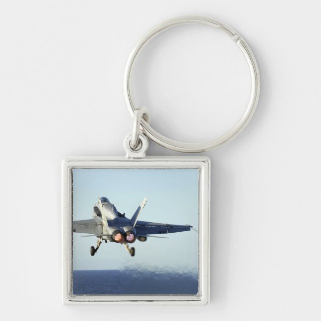 An F/A-18C Hornet launches from the flight deck Key Ring (Front)