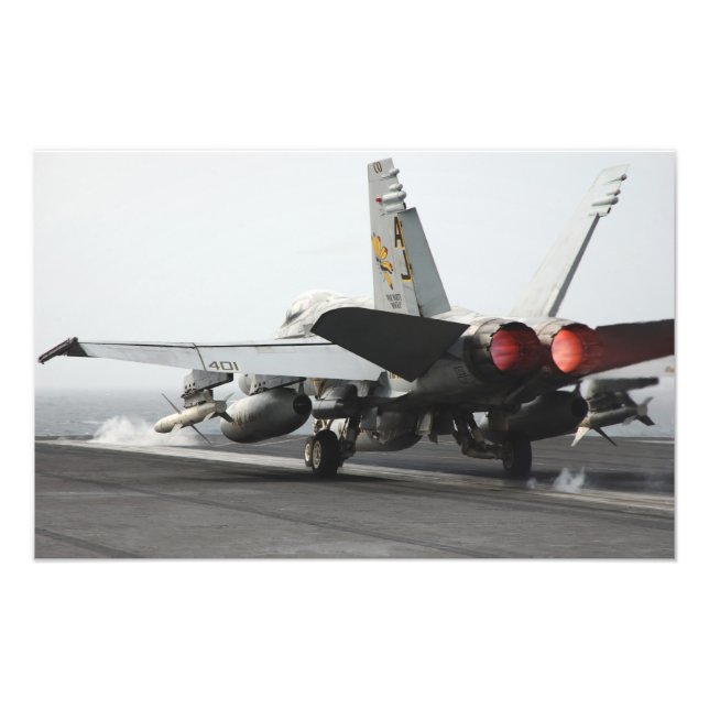 An F/A-18C Hornet launches from the flight deck Photo Print (Front)