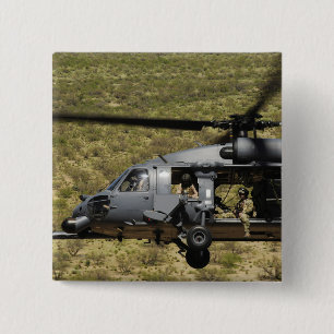 An HH-60 Pave Hawk flies over the desert 15 Cm Square Badge