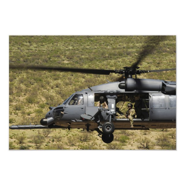 An HH-60 Pave Hawk flies over the desert Photo Print (Front)