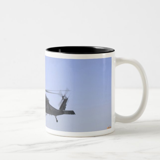 An HH-60G Pave Hawk taking off from Camp Bastio Two-Tone Coffee Mug (Right)