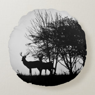 An image of some deer in the morning mist round cushion