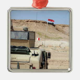 An instructor watches as an Iraqi army soldier Metal Tree Decoration