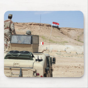 An instructor watches as an Iraqi army soldier Mouse Mat