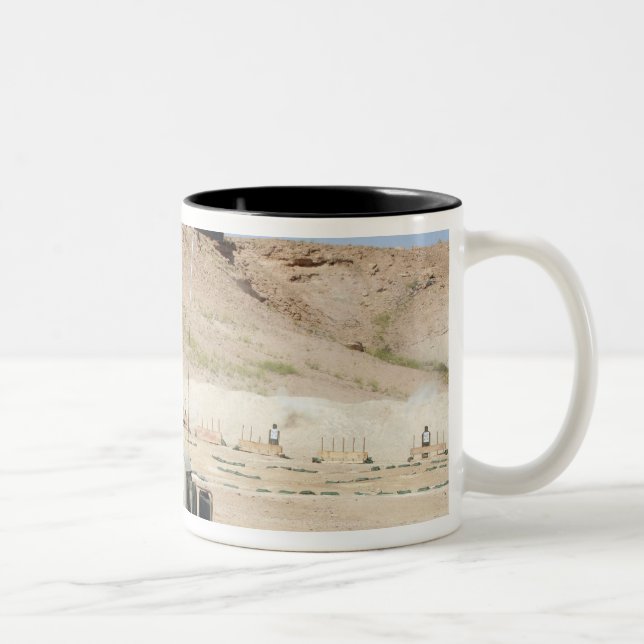 An instructor watches as an Iraqi army soldier Two-Tone Coffee Mug (Right)