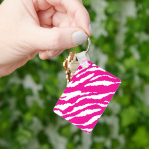 An intricate floral pattern in pink and white, art key ring