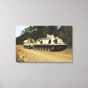 An M-88 recovery vehicle begins to tow an M992 Canvas Print
