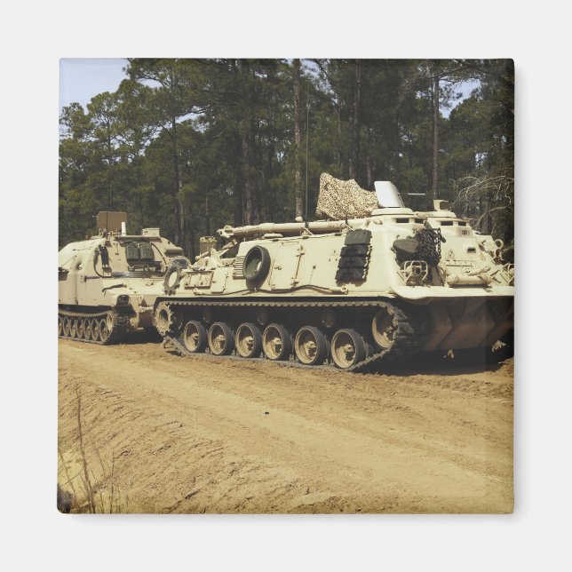 An M-88 recovery vehicle begins to tow an M992 Magnet (Front)
