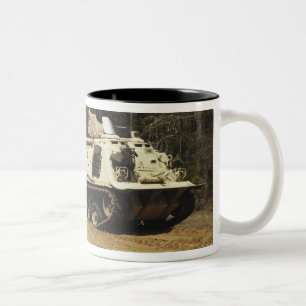 An M-88 recovery vehicle begins to tow an M992 Two-Tone Coffee Mug
