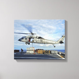 An MH-60S Seahawk prepares to deliver ammunitio Canvas Print