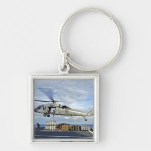 An MH-60S Seahawk prepares to deliver ammunitio Key Ring