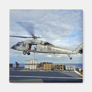 An MH-60S Seahawk prepares to deliver ammunitio Magnet