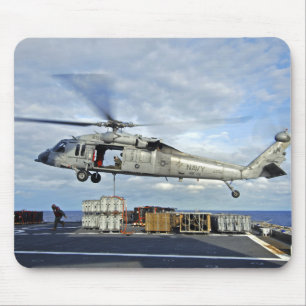 An MH-60S Seahawk prepares to deliver ammunitio Mouse Mat