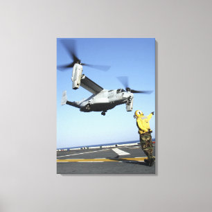 An MV-22 Osprey launches from the USS Nassau Canvas Print