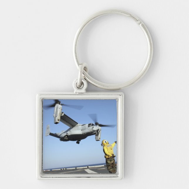 An MV-22 Osprey launches from the USS Nassau Key Ring (Front)