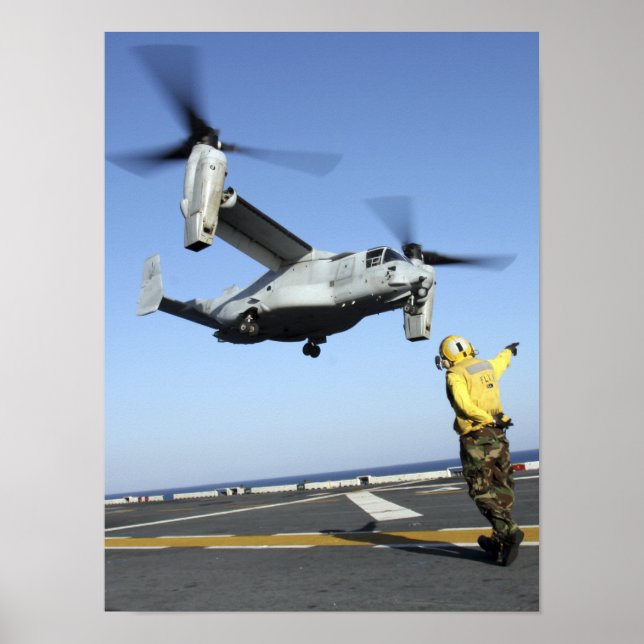 An MV-22 Osprey launches from the USS Nassau Poster (Front)