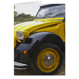 An old black and yellow Citroen 2CV 2 CV,