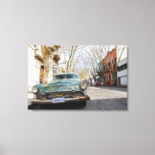 An old car rusty and flaky colour parked in the canvas print
