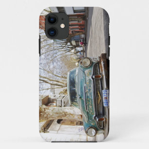 An old car rusty and flaky colour parked in the iPhone 11 case