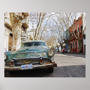 An old car rusty and flaky colour parked in the poster