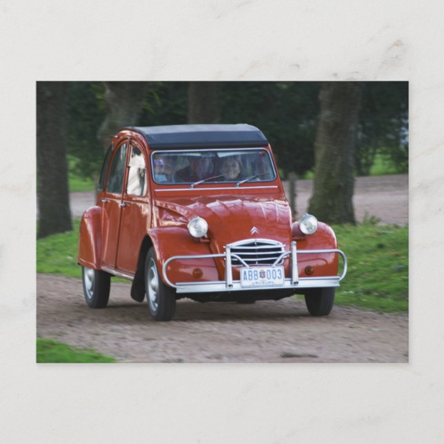 An old red Citroen 2CV car with a smiling woman Postcard (Front)