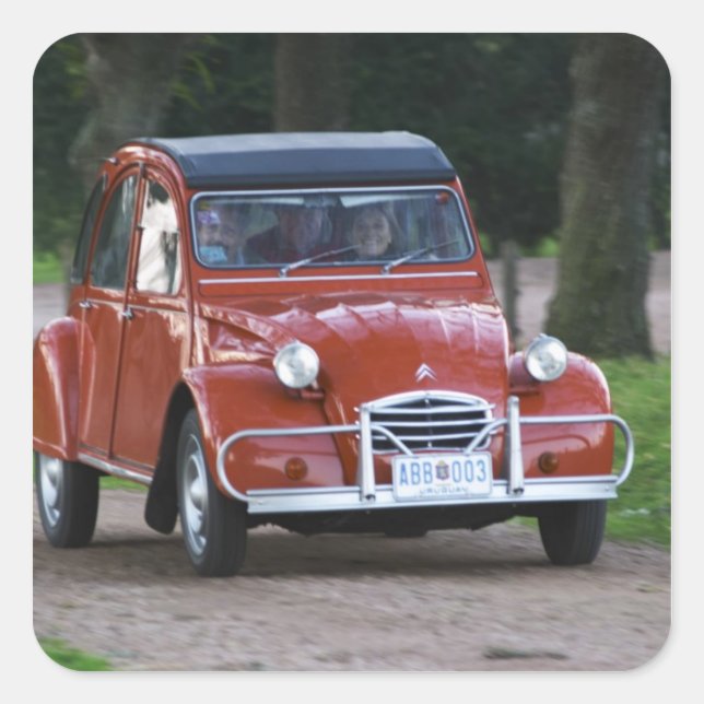 An old red Citroen 2CV car with a smiling woman Square Sticker (Front)