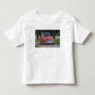 An old red Citroen 2CV car with a smiling woman Toddler T-Shirt