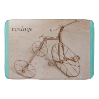 AN OLD TRICYCLE 1928 BATH MATS
