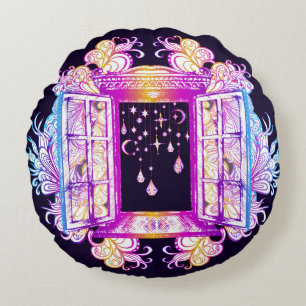 An open vintage window with pendants against a bac round cushion